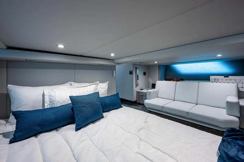 Legacy Yacht Photos Pics Luxurious interior of 2022 Formula 500 Super Sport Crossover with modern seating and bedding.