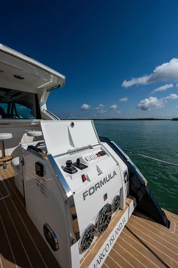 Legacy Yacht Photos Pics 2022 Formula 500 Super Sport Crossover yacht on water under blue sky.