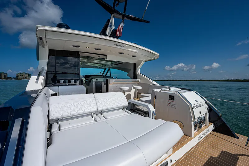 Legacy Yacht Photos Pics 2022 Formula 500 Super Sport Crossover yacht with luxurious seating on open water.