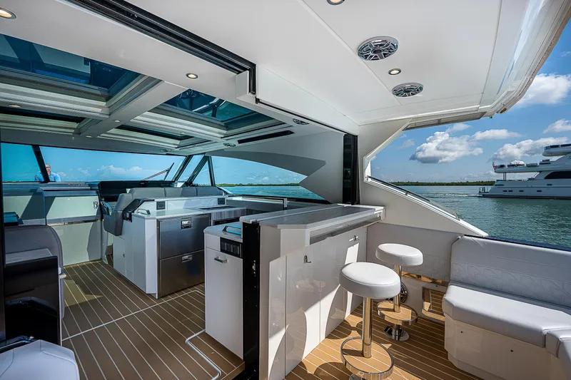 Legacy Yacht Photos Pics Luxurious 2022 Formula 500 Super Sport Crossover yacht interior with modern seating and ocean view.