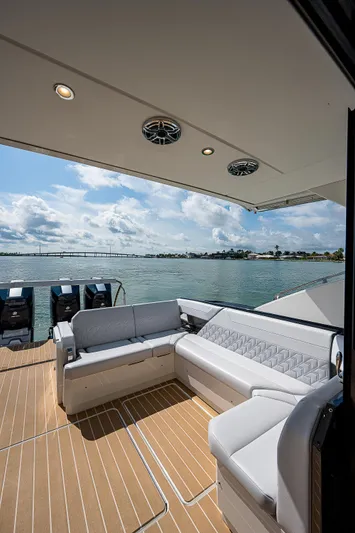 Legacy Yacht Photos Pics 2022 Formula 500 Super Sport Crossover yacht with luxurious seating and scenic water view.