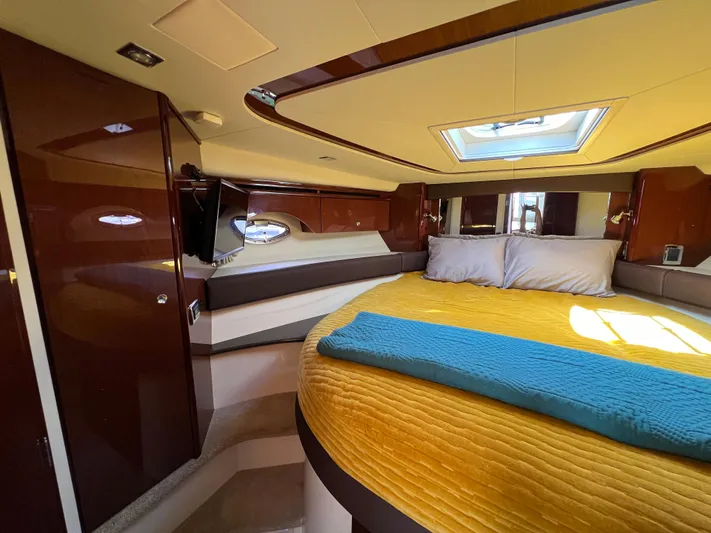  Yacht Photos Pics Luxurious interior of 2013 Meridian 441 Sedan yacht with cozy bed and skylight.