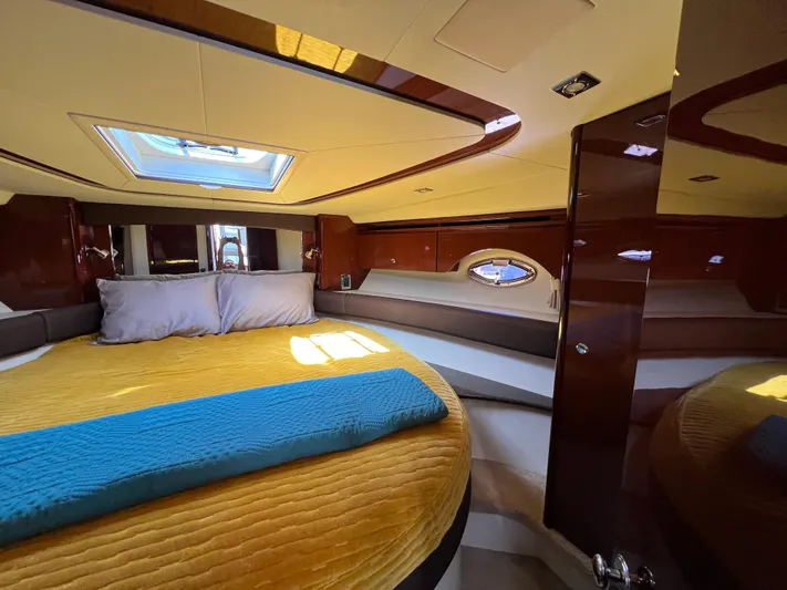  Yacht Photos Pics Luxurious 2013 Meridian 441 Sedan cabin with skylight and plush bedding.