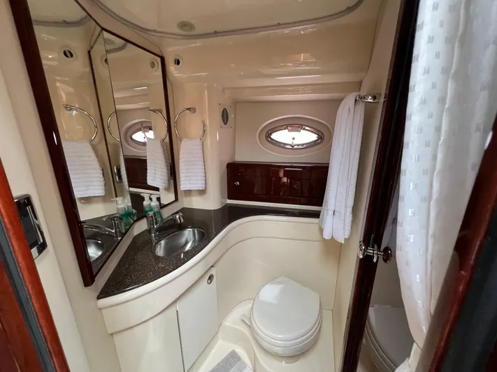  Yacht Photos Pics Luxurious bathroom in 2013 Meridian 441 Sedan yacht with modern fixtures and elegant design.