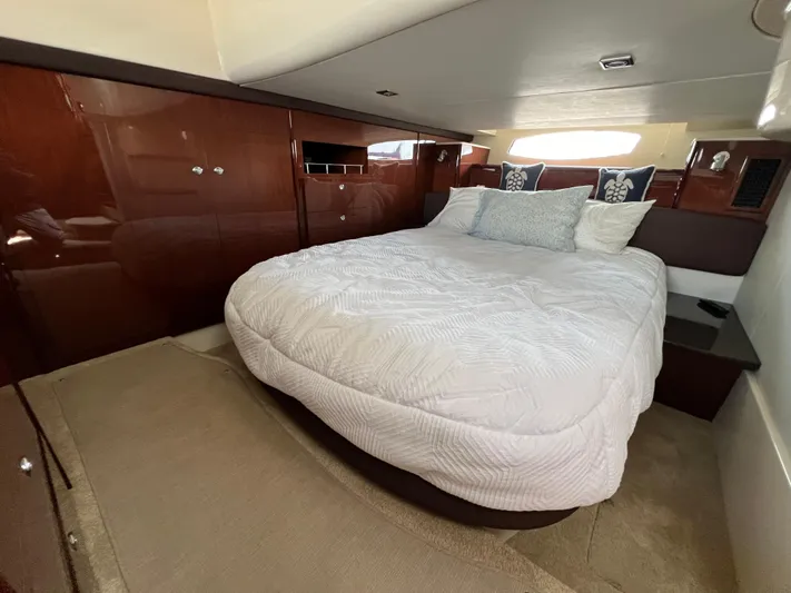  Yacht Photos Pics Luxurious bedroom interior of 2013 Meridian 441 Sedan yacht with plush bedding.