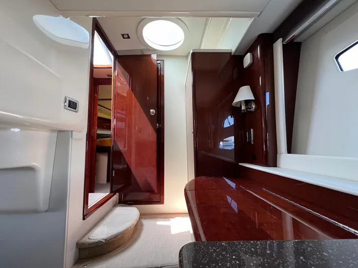  Yacht Photos Pics Luxurious interior of a 2013 Meridian 441 Sedan yacht, featuring polished wood and modern design.