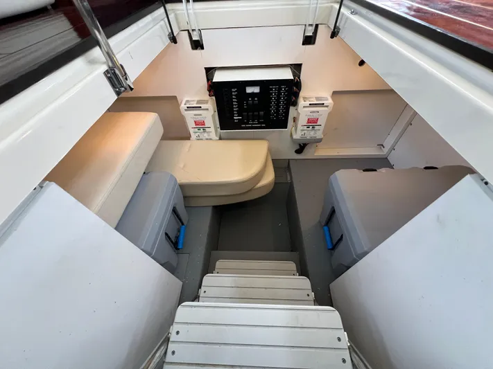  Yacht Photos Pics Interior of 2013 Meridian 441 Sedan yacht with seating and control panel.