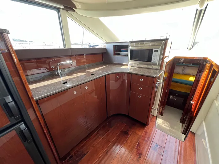  Yacht Photos Pics Luxurious 2013 Meridian 441 Sedan yacht interior with modern kitchen and cozy cabin.