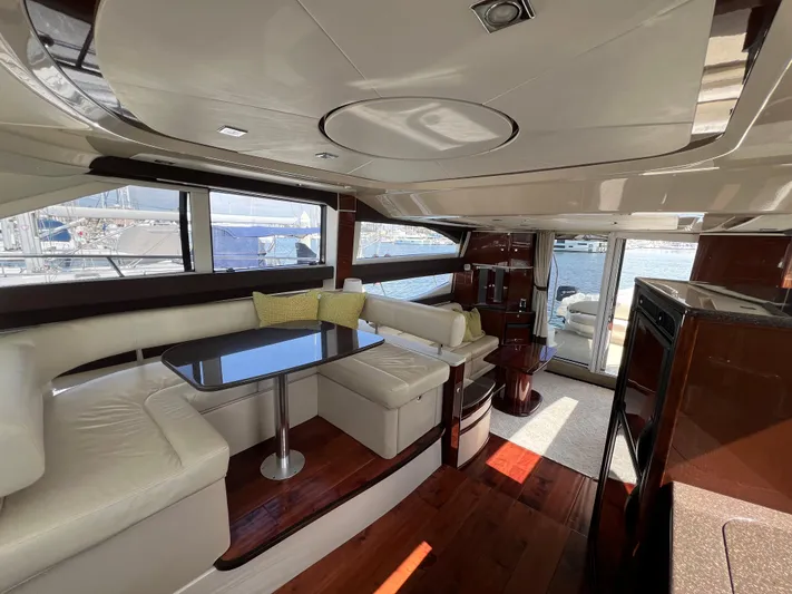  Yacht Photos Pics Luxurious interior of a 2013 Meridian 441 Sedan yacht with elegant seating and dining area.