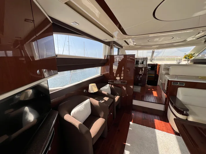  Yacht Photos Pics Luxurious interior of a 2013 Meridian 441 Sedan yacht with elegant wood finishes.