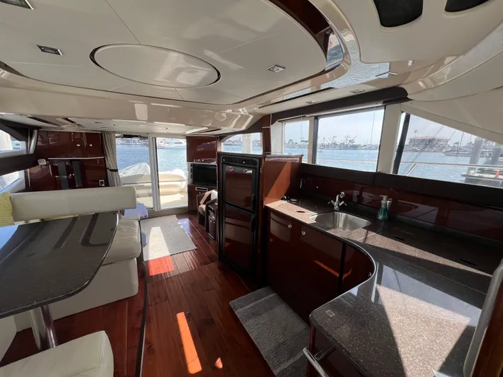  Yacht Photos Pics Luxurious interior of a 2013 Meridian 441 Sedan yacht with modern amenities and waterfront view.