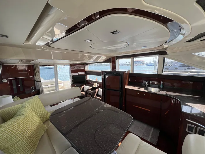  Yacht Photos Pics Luxurious interior of a 2013 Meridian 441 Sedan yacht with modern amenities and waterfront view.