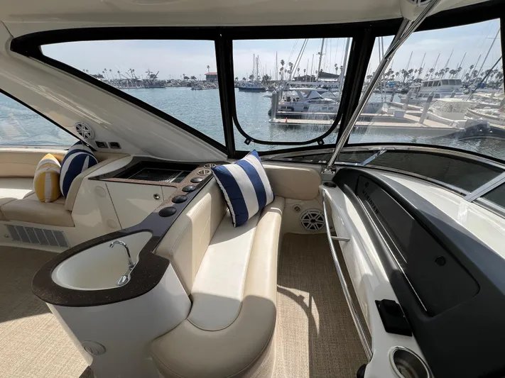  Yacht Photos Pics Interior of 2013 Meridian 441 Sedan yacht with plush seating and marina view.