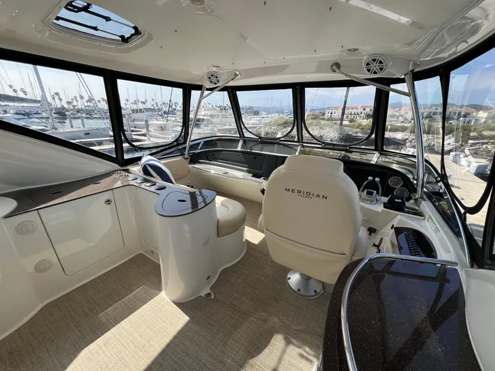  Yacht Photos Pics Interior of 2013 Meridian 441 Sedan yacht with panoramic windows and luxurious seating.