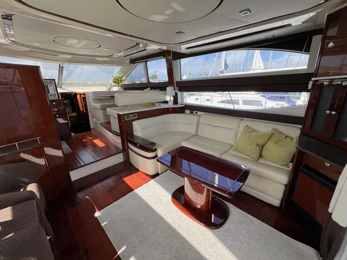  Yacht Photos Pics Luxurious interior of 2013 Meridian 441 Sedan yacht with elegant seating and wooden finishes.