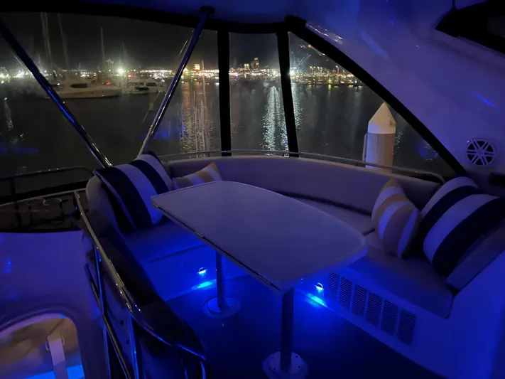  Yacht Photos Pics Luxurious 2013 Meridian 441 Sedan yacht interior with ambient blue lighting at night.