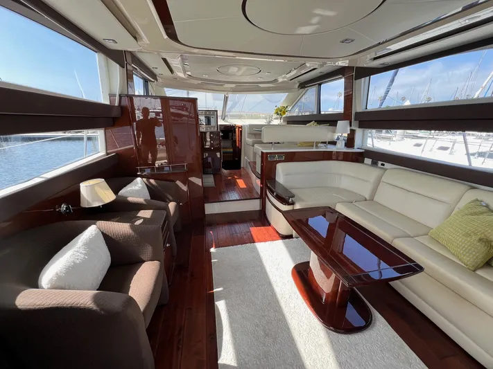  Yacht Photos Pics Luxurious interior of a 2013 Meridian 441 Sedan yacht with elegant seating and wood finishes.