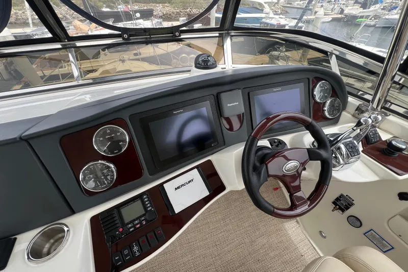  Yacht Photos Pics 2013 Meridian 441 Sedan helm with modern navigation displays and controls.