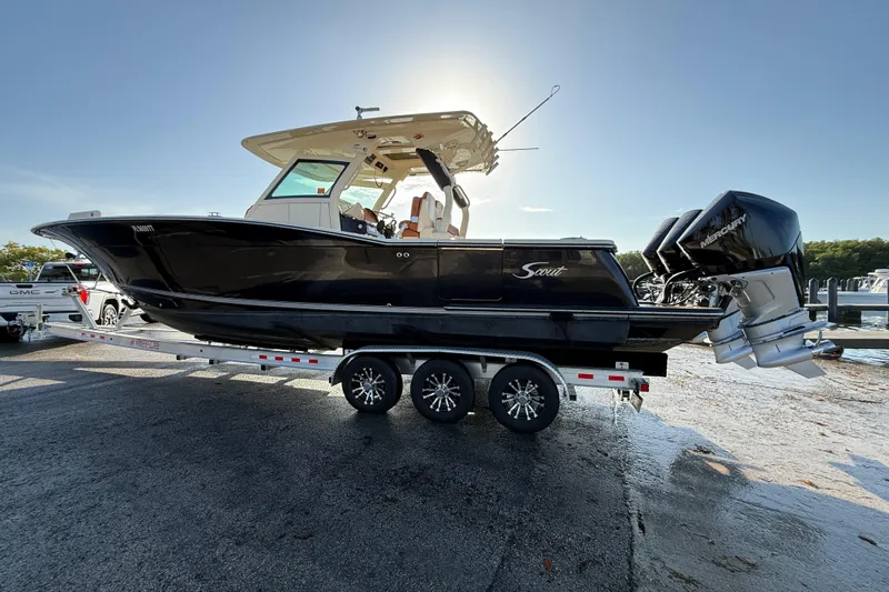  Yacht Photos Pics 2019 Scout 355 LXF boat on trailer with dual Mercury engines, parked outdoors.