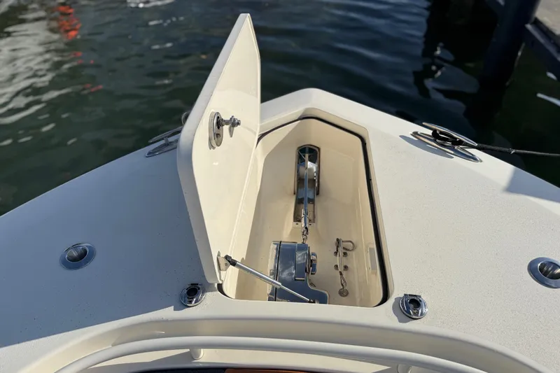  Yacht Photos Pics 2019 Scout 355 LXF boat anchor compartment open, docked on water.
