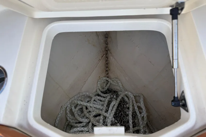  Yacht Photos Pics Anchor storage compartment on a 2019 Scout 355 LXF boat with rope and chain.