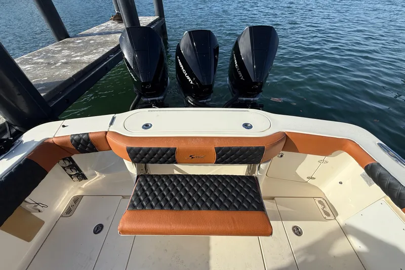  Yacht Photos Pics 2019 Scout 355 LXF boat with triple Mercury engines at dock.