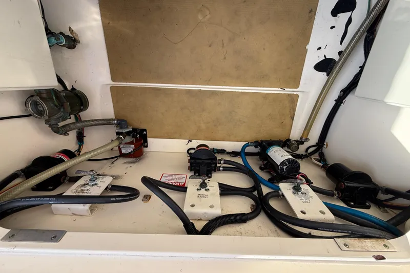  Yacht Photos Pics 2019 Scout 355 LXF boat interior showing mechanical components and wiring.