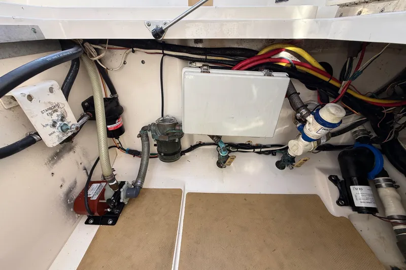  Yacht Photos Pics Engine compartment of 2019 Scout 355 LXF boat with wiring and components visible.