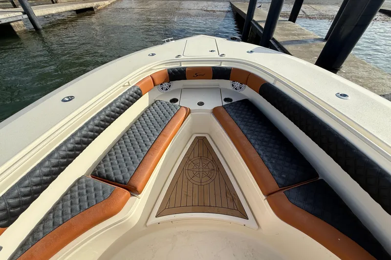  Yacht Photos Pics 2019 Scout 355 LXF boat interior with luxurious seating and wood accents.