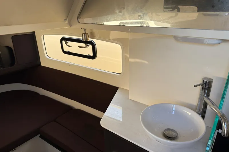  Yacht Photos Pics 2019 Scout 355 LXF boat interior with sink and seating area.