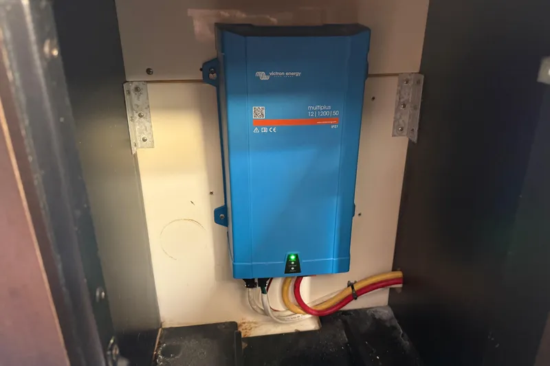  Yacht Photos Pics Blue Victron Energy MultiPlus inverter in a 2019 Scout 355 LXF boat compartment.