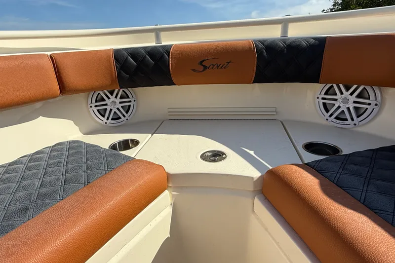  Yacht Photos Pics 2019 Scout 355 LXF boat interior with cushioned seating and speakers.