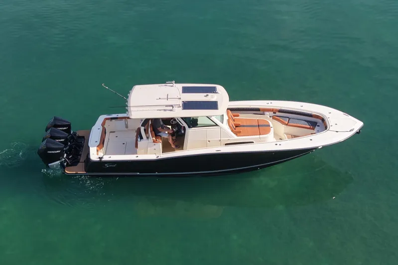  Yacht Photos Pics 2019 Scout 355 LXF motorboat on calm water.