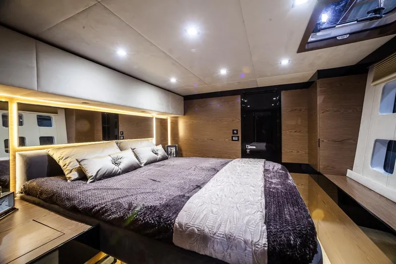 Darlin ( Ex Fine Line) Yacht Photos Pics Luxurious bedroom interior of 2015 Sunreef 60 LOFT yacht with modern lighting and cozy bedding.