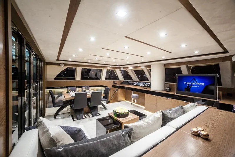 Darlin ( Ex Fine Line) Yacht Photos Pics Luxurious interior of 2015 Sunreef 60 LOFT yacht with modern dining and lounge area.