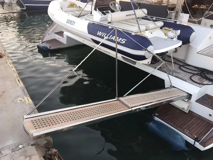 Darlin ( Ex Fine Line) Yacht Photos Pics 2015 Sunreef 60 LOFT yacht with extended gangway and tender at dock.