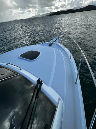 Del Mar Yacht Photos Pics 2015 Boston Whaler 345 Conquest on calm waters under cloudy skies.