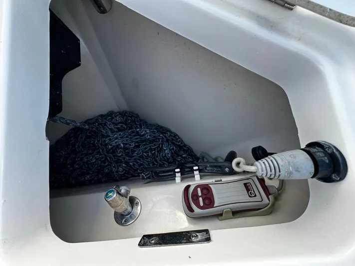 Del Mar Yacht Photos Pics Storage compartment on a 2015 Boston Whaler 345 Conquest boat with rope and equipment.