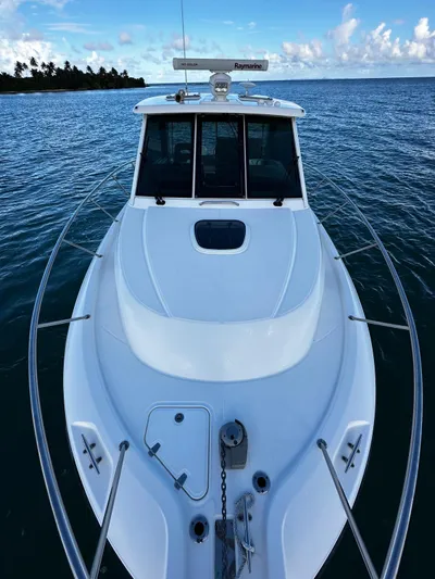 Del Mar Yacht Photos Pics 2015 Boston Whaler 345 Conquest boat on calm ocean waters.