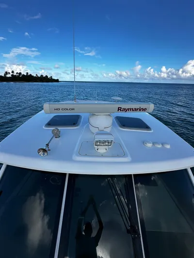 Del Mar Yacht Photos Pics Boston Whaler 345 Conquest 2015 on calm ocean with clear blue sky.