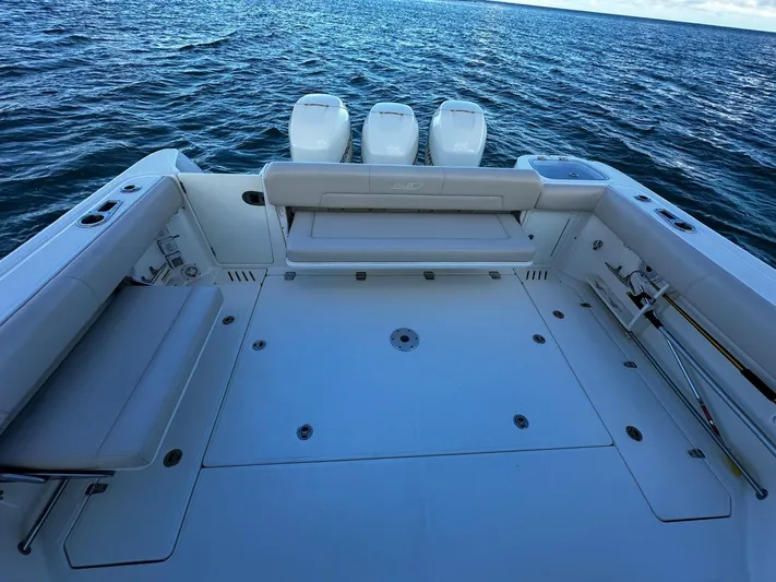 Del Mar Yacht Photos Pics 2015 Boston Whaler 345 Conquest boat deck with triple engines on open water.