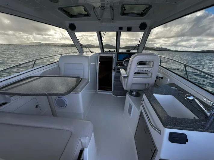 Del Mar Yacht Photos Pics Interior of 2015 Boston Whaler 345 Conquest boat with seating and helm.