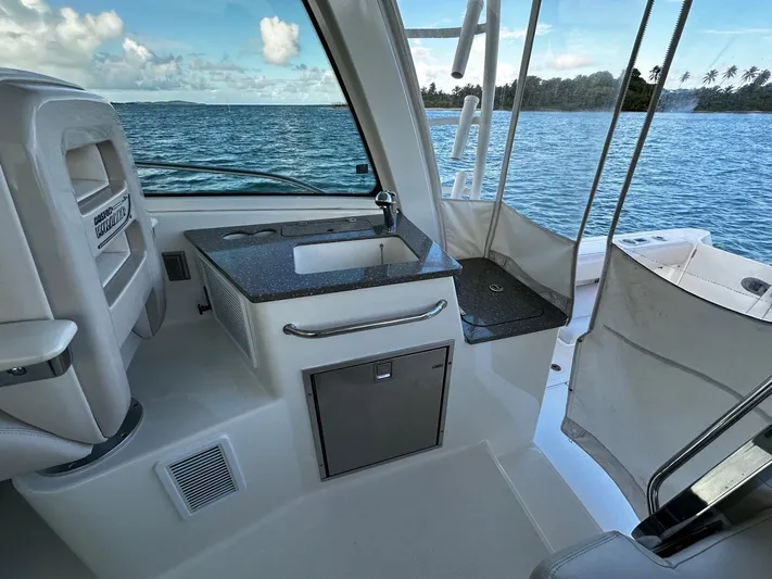 Del Mar Yacht Photos Pics Boston Whaler 345 Conquest 2015 interior with sink and ocean view.