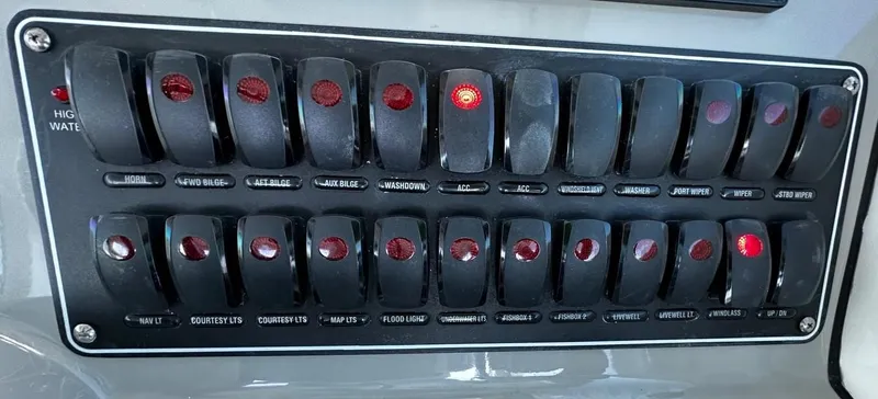 Del Mar Yacht Photos Pics Control panel of a 2015 Boston Whaler 345 Conquest boat with labeled switches.