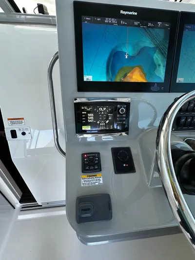 Del Mar Yacht Photos Pics Boston Whaler 345 Conquest 2015 helm with Raymarine navigation display and controls.