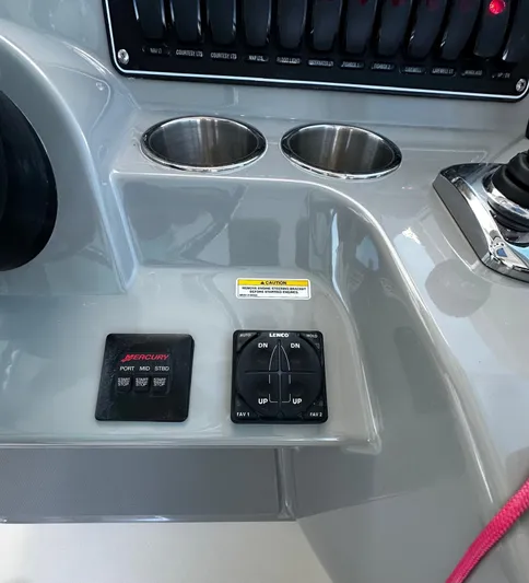 Del Mar Yacht Photos Pics 2015 Boston Whaler 345 Conquest dashboard with controls and cup holders.