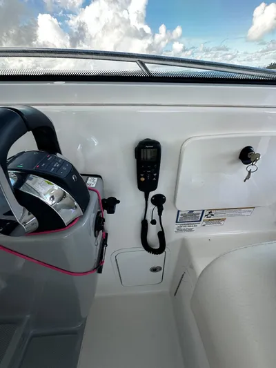 Del Mar Yacht Photos Pics 2015 Boston Whaler 345 Conquest helm with controls and navigation equipment.