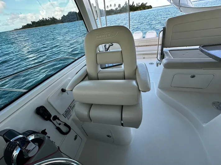 Del Mar Yacht Photos Pics Boston Whaler 345 Conquest 2015 interior with captain's chair and ocean view.