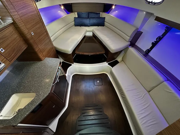 Del Mar Yacht Photos Pics Luxurious interior of 2015 Boston Whaler 345 Conquest with modern seating and ambient lighting.