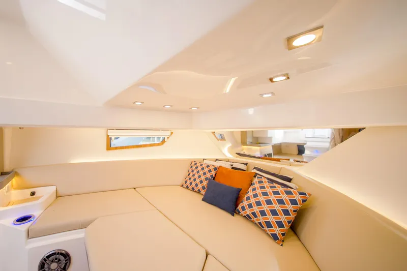  Yacht Photos Pics Luxurious interior of 2026 Granfort 37 yacht with plush seating and decorative cushions.